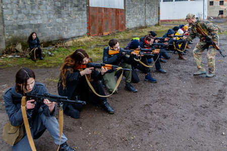 Uzhgorod region, Ukraine - February 19, 2022: Civilians in Ukraine are training in one of the abandoned factories to defend their country in case of Russian invasion.のeditorial素材