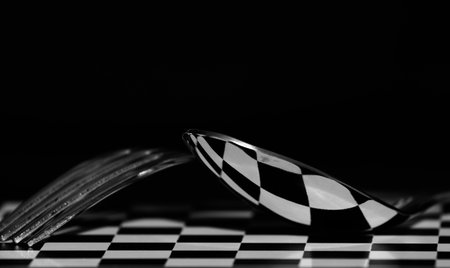 Abstract picture. Chess table with cutlery and reflection.
