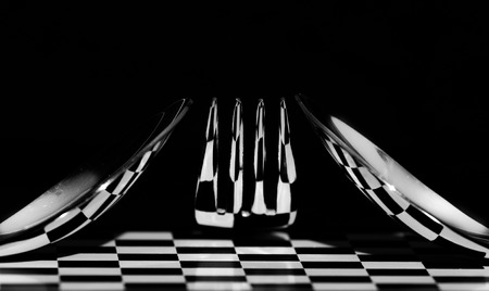 Abstract picture. Chess table with cutlery and reflection.の写真素材
