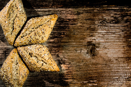 Bread loaf on a rustic wood . Free space for text. Top view