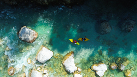 Whitewater Rafting on the Emerald waters of Soca river, Slovenia, are the rafting paradise for adrenaline seekers and also nature lovers, aerial view.の写真素材