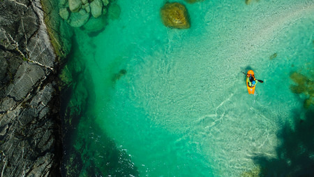 Whitewater Rafting on the Emerald waters of Soca river, Slovenia, are the rafting paradise for adrenaline seekers and also nature lovers, aerial view.の写真素材