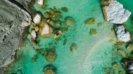 Whitewater Rafting on the Emerald waters of Soca river, Slovenia, are the rafting paradise for adrenaline seekers and also nature lovers, aerial view.の写真素材