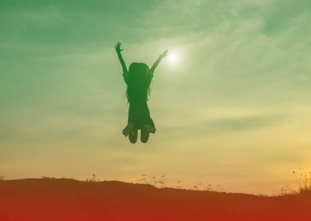 Young woman relaxing in summer sunset sky outdoor. People freedom style.の写真素材