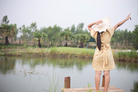 Beautiful woman and the beautiful nature of freedom of life.の写真素材