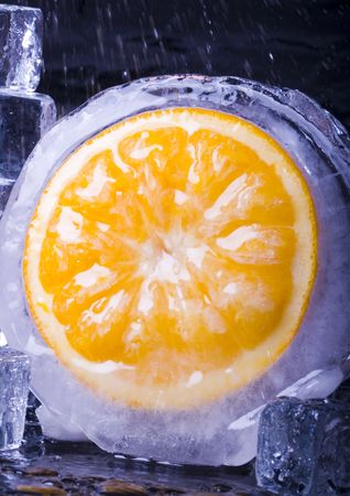 Orange with ice cubesの写真素材