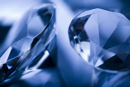 Diamonds isolated on blue background の写真素材