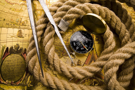 Compass on the old map background  