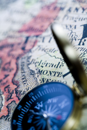 Compass on the old map background  