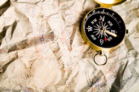 Old-fashioned compass on map 