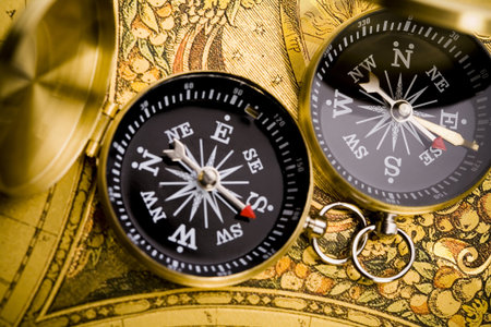 Compass on the old map background  
