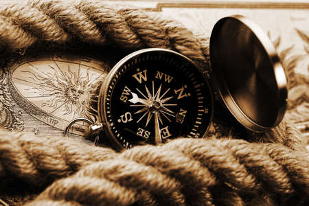 Old-fashioned compass on map の写真素材