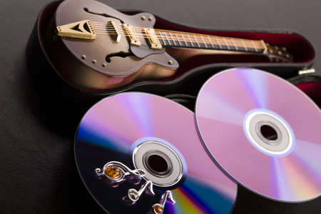 Discs and guitar の写真素材