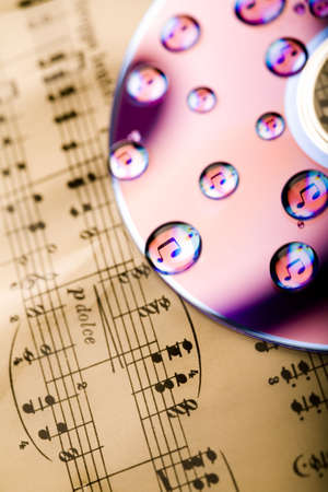 Background made from water drops, disc, and notes の写真素材