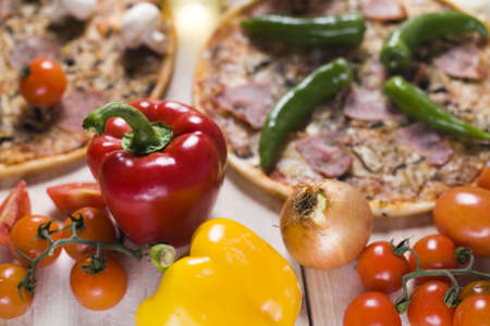 Fresh vegetables with a pizzaの写真素材