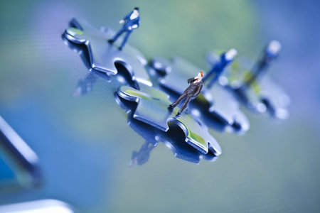 Laptop with figure over silver backgroundの写真素材