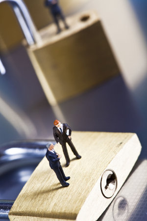 Business man on secure pedlock