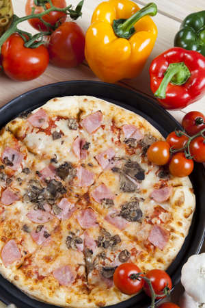Fresh vegetables with a pizzaの写真素材