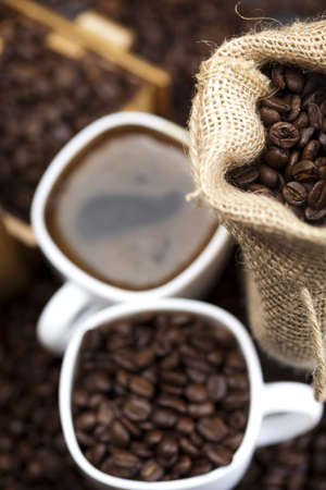 Cup of coffee with sack of coffee beanの写真素材