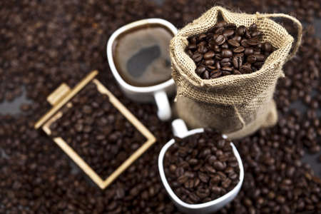 Cup of coffee with sack of coffee beanの写真素材