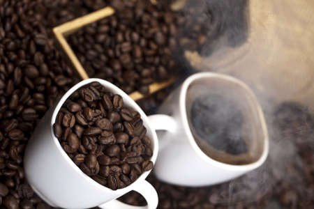 Cup of coffee with sack of coffee beanの写真素材