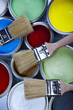 Cans and paint and brushes on the Colorful backgroundの写真素材