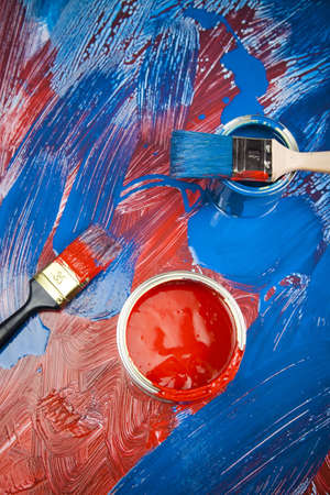 Cans and paint and brushes on the Colorful backgroundの写真素材