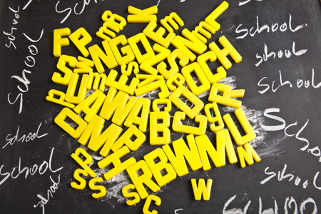 Alphabet and letters on a school blackboard の写真素材