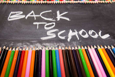 Inscription on a school chalkboard - back to school の写真素材