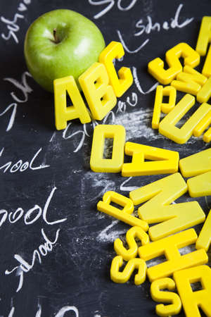 Apple and letters on a blackboard  の写真素材