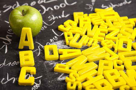 Apple and letters on a blackboard  の写真素材