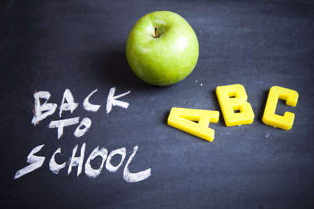 Inscription on a school chalkboard - back to school の写真素材