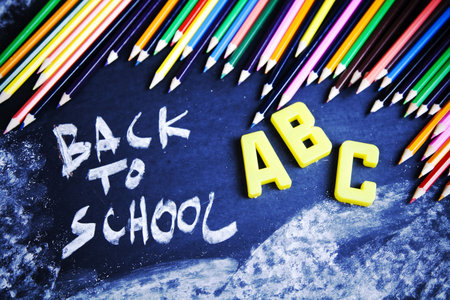 Blackboard, wooden pencils and back to school