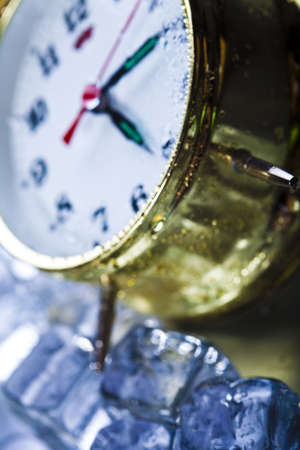 The time has come - alarm clock and ice の写真素材