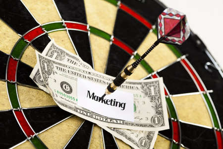 Darts target and dollar in bull's-eyeの写真素材