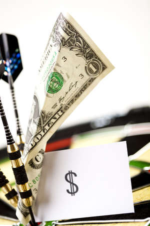 Darts target and dollar in bull's-eyeの写真素材