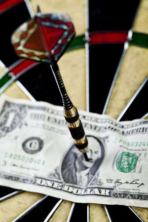 Darts target and dollar in bull's-eyeの写真素材