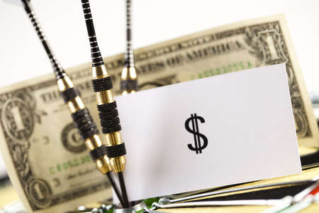 Darts target and dollar in bull's-eyeの写真素材