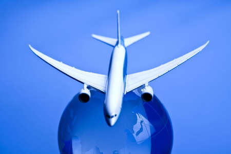 Airliner with earth in the blue backgroundの写真素材