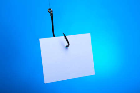 Blank on piece of paper on hookの写真素材