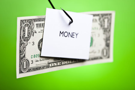 Dollar sign on piece of paper on hook
