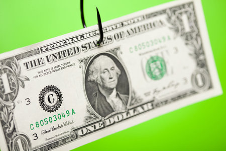 Dollar sign on piece of paper on hook