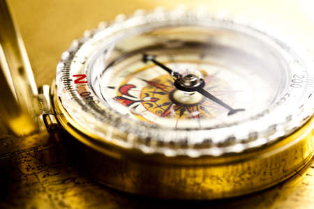 Close up view of the compass on old mapの写真素材