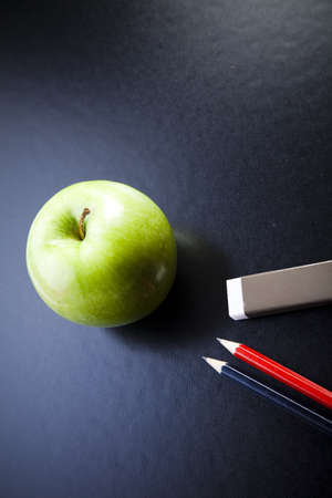 Apple on a blackboardの写真素材