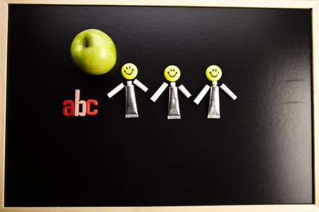 Apple on a blackboard の写真素材