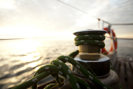 Ropes on wooden and Yacht の写真素材