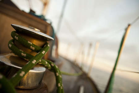 Winch with rope on sailing boat in the sea の写真素材