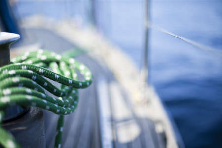 Winch with rope on sailing boat in the sea の写真素材