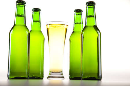 Glass of beer on a white background の写真素材