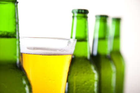 Glass of beer on a white background の写真素材